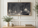 Snowy Park Lamplight art on a TV in a living room